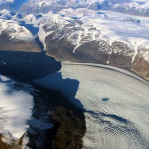 Satellite image of Greenland showing ice sheets and glaciers, captured by NASA for climate change research.