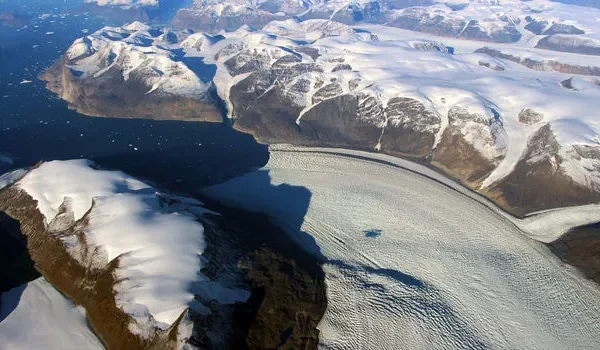 Satellite image of Greenland showing ice sheets and glaciers, captured by NASA for climate change research.