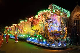 Illuminated floats parade at Bridgwater Carnival 2024, showcasing colorful lights, music, and festive atmosphere under the night sky.