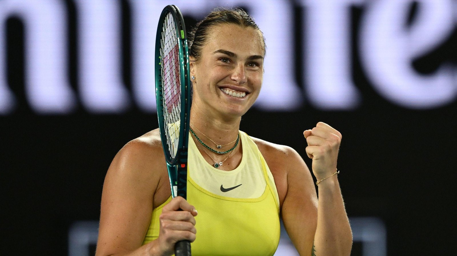 Aryna Sabalenka, Belarusian tennis player, showcasing her powerful serve and athleticism during a Grand Slam match.